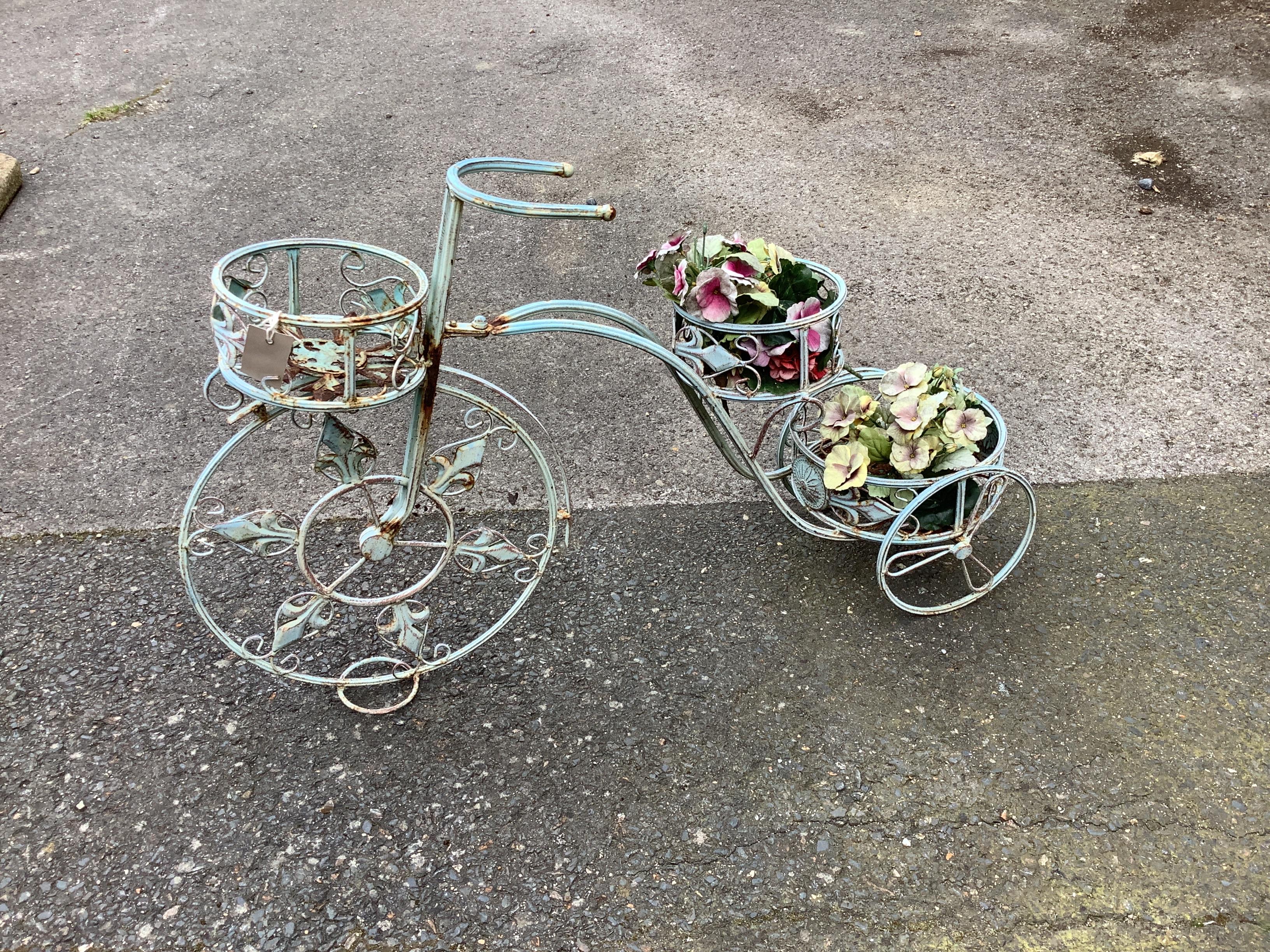 A painted metal bicycle plant stand, length 90cm